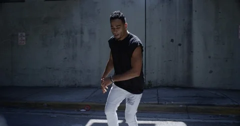 Male dancer performing his routine under an overpass Stock Footage 97030296
