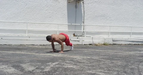 Male dancer performing his routine on top of a parking garage Stock Footage 97035199