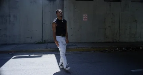 Male dancer performing his routine under an overpass Stock Footage 97036856