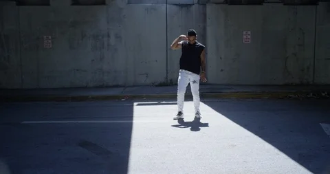 Male dancer performing his routine under an overpass Stock Footage 97038258