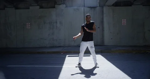Male dancer performing his routine under an overpass Stock Footage 97040056