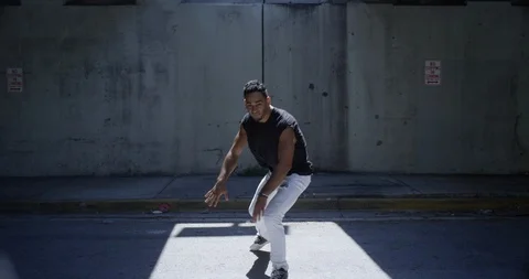 Male dancer performing his routine under an overpass Stock Footage 97238887