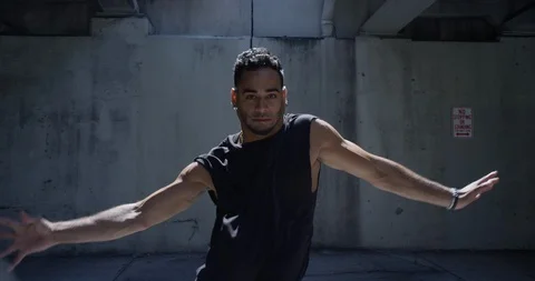 Male dancer performing his routine under an overpass Stock Footage 97449530