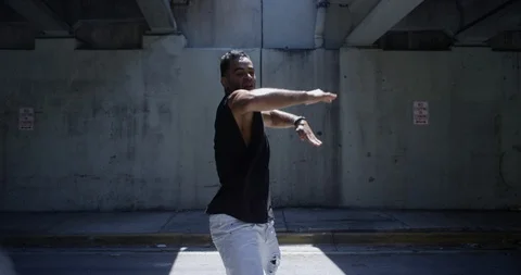 Male dancer performing his routine under an overpass Stock Footage 97500823