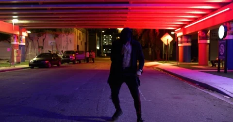 Male dancer performing his routine under an overpass at night Stock Footage 100182959