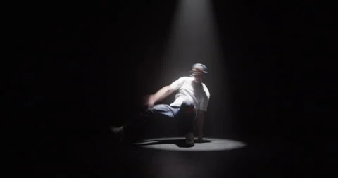 Male dancer in spotlight dancing breakdance Stock Footage 244525297