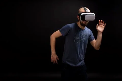 Male dancing while using VR gear. Fun experience Stock Photos