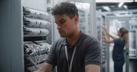 Male Data Center Engineer Replacing Network Switch in Server Rack Stock Footage 344969588