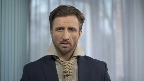 Male with death rope instead of tie looking at himself, taking risks, venture Stock Footage 76148917