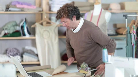 Male designer communicates with a client on a video call, he asks questions Stock Footage 318945915