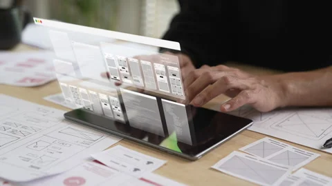 A male designer working on website prototype Stock Footage 340902188