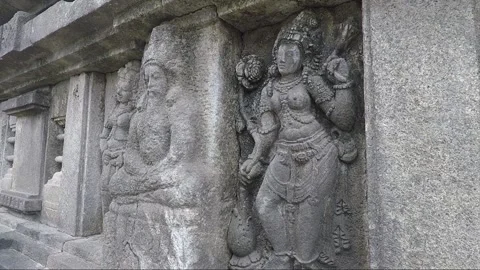 A male devata flanked by two apsaras, Vishnu temple, Prambanan, Java, Indonesia Stock Footage 250270485