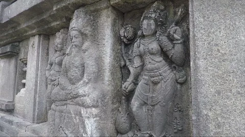 A male devata flanked by two apsaras, Vishnu temple, Prambanan, Java, Indonesia Stock Footage 250270507