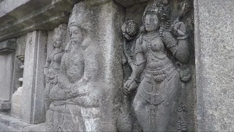 A male devata flanked by two apsaras, Vishnu temple, Prambanan, Java, Indonesia Stock Footage 250270542