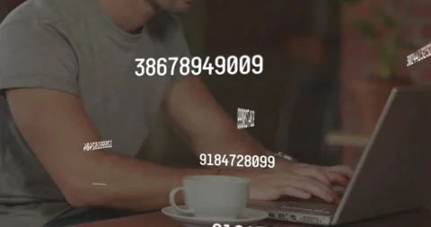 Male developer coding on laptop in cafe while numeric codes forming and swirling Stock Footage 318475643