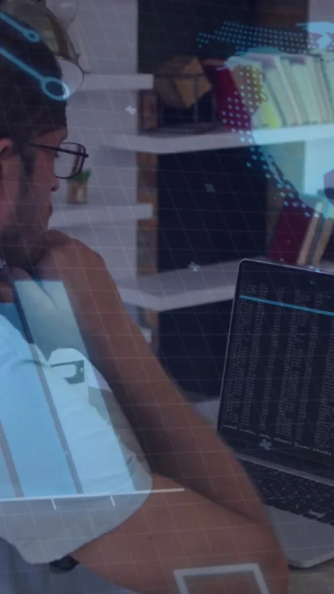 Male developer leaning, adjusting chin while blue HUD globe appearing over Video stock 331790224