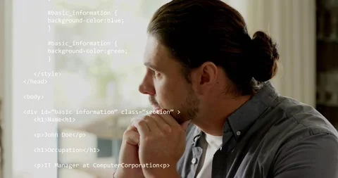 Male developer leaning at desk and scrolling HTML CSS tech code revealing user Stock Footage 317716083