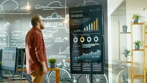 Male Developer Looks at Interactive Whiteboard with Mock-up Green Screen.  Stock Footage 82901522