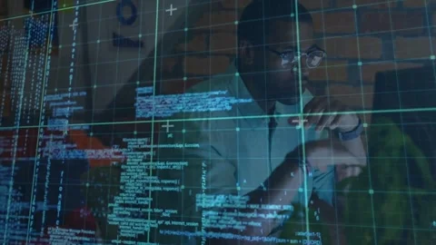 Male developer sitting behind translucent display, code appearing and leading to Stock Footage 331270123