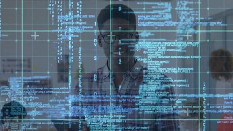 Male developer studying tablet in open office, activating blue code grid testing Video stock 331270144