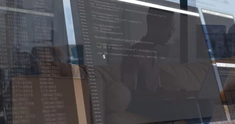 Male developer typing on laptop in casual office, with animated code overlay Stock Footage 307439852