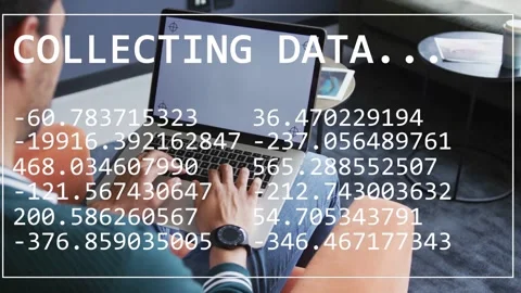 Male developer typing on laptop, initiating COLLECTING DATA overlay and updating Stock Footage 334788509