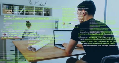Male developer typing on laptop in office, generating green code overlay for Stock Footage 331820822