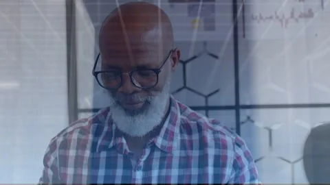 Male developer typing at laptop in office causing cloud overlay and binary panel Stock Footage 334694370
