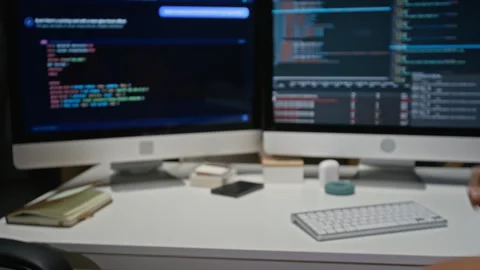 Male Developers Fist Bumping by Computer Screens with Code 스톡 동영상 348378432