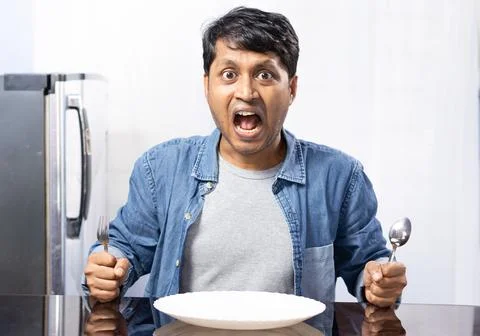 Male at dining table Stock Photos