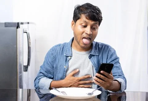Male at dining table Stock Photos