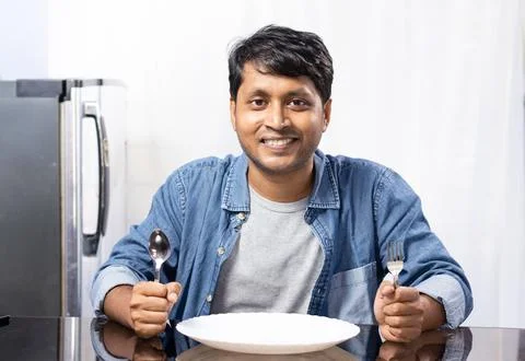 Male at dining table Stock Photos