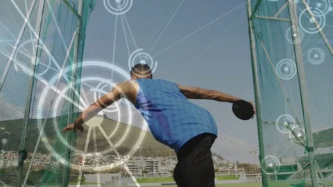 Male discus thrower entering ring rotating and throwing, sports training in net Stock Footage 333154827