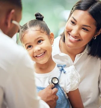 Male doctor examining happy little girl by stethoscope. Child sitting with Stock Photos