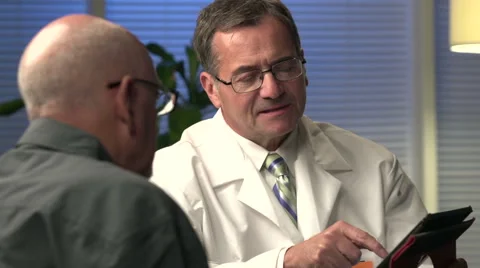 Male doctor explaining information with tablet - close Stock Footage 44018242