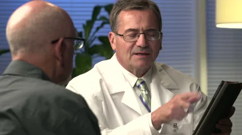 Male doctor explaining information with tablet - close Stock Footage 44018441