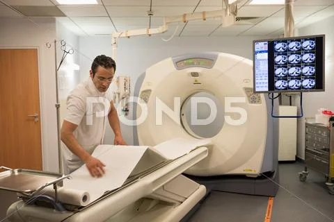 Male Doctor Preparing Medical Mri Scanner In Hospital