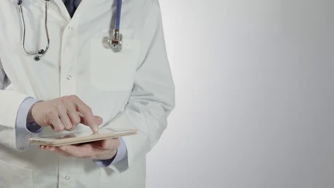 Male doctor using tablet pc Stock Footage 81177992