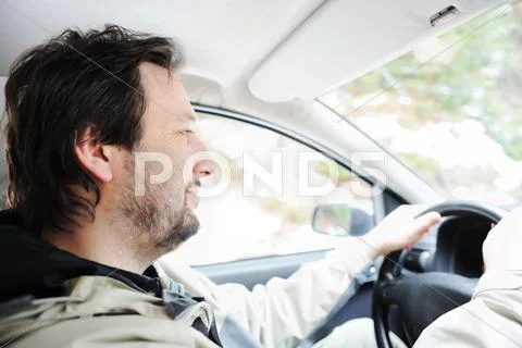Male driver in car Stock Photos