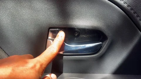Male driver pressing button locking doors in car Vídeo Stock 340569085