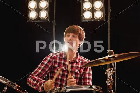 A male drummer performing on stage Stock Photos