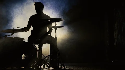 Male Drummer Silhouette Playing the Drums. High contrast. Stock Footage