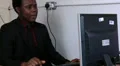Male is emotional as he attacks his keyboard and monitor HD Footage