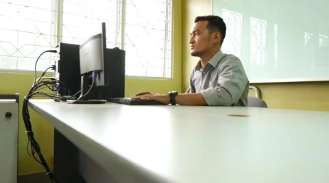 A male employee using a computer Stock Footage 48135030