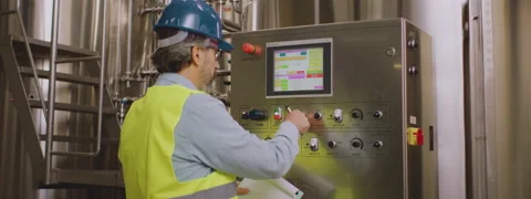 Male engineer adjusting process settings Stock Footage 147563906