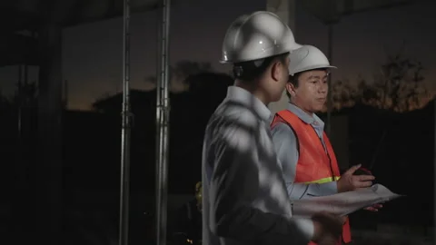 Male engineer and construction supervisor working late or overtime. Stock Footage 170832720