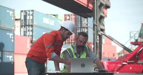 Male engineer and Foreman using laptop computer to check control loading. Stock Footage 200987547