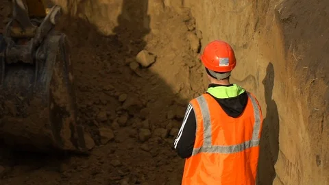 Male engineer, builder, foreman, worker in uniform and hard hat working on Stock Footage 98323344