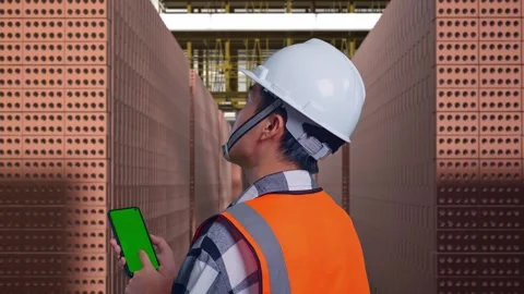 Male Engineer Celebrating While Working With Brick In Stacks Stock Footage 303761041