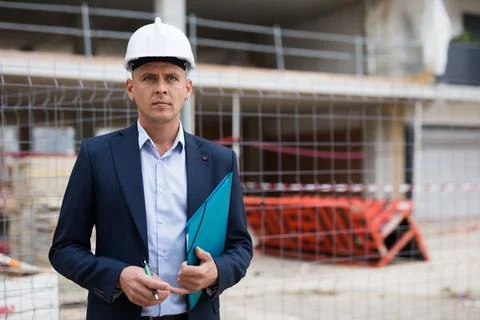 Male engineer checking work process in construction site Stock Photos